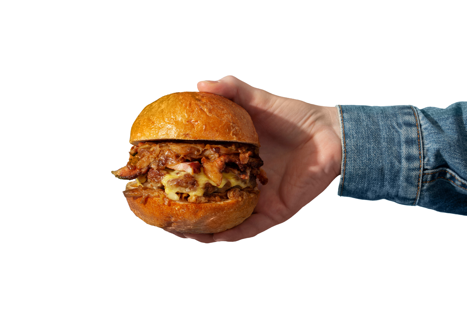 A loaded Hutt Ribs burger held in hand